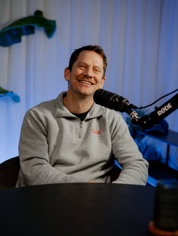 Stu Moerman laughing at the microphone during the Episode 2 recording.