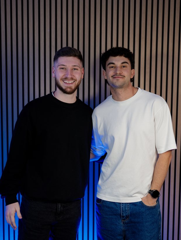Jackson Morton and Bailey Williams standing together in the studio after recording.